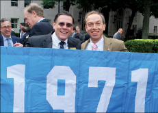 Alex Sachare ’71 (left) and Eddie Eitches ’71 prepare to march with their class banner in this year’s Alumni Parade of Classes. Ethan Rouen ’04J